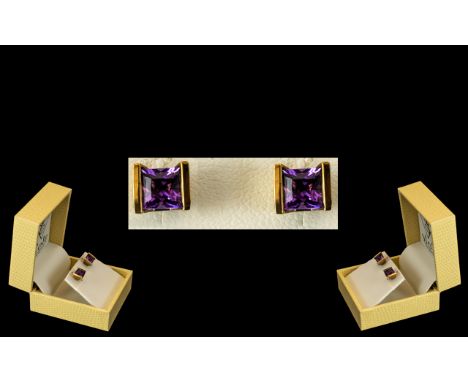Ladies 9ct Gold Pair of Attractive Princess Cut Amethyst Set Earrings. Marked 9.375. Of Square Form, With Display Box. As New