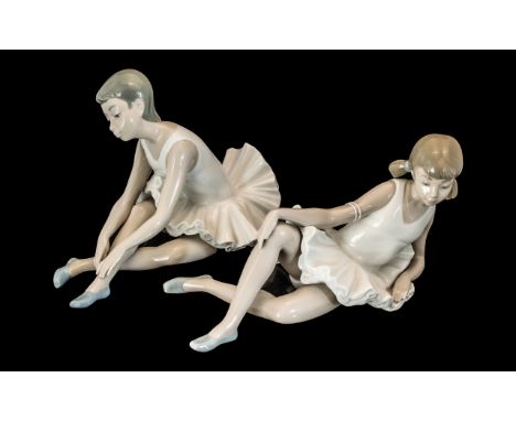 Two Nao Ballet Figurines, depicting young ladies warming up for ballet.  Comprising Nao by Lladro #2010151-Slipper Ballet Bal