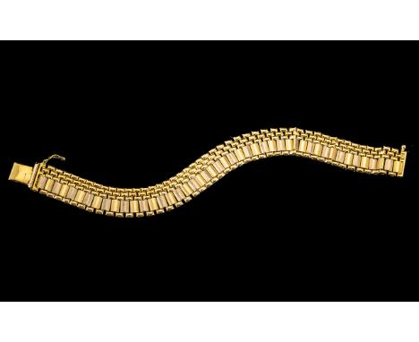 18ct Iranian Bracelet, in two colour gold, with brick and tile shaped gold pieces making up the solid style bracelet.  Weight