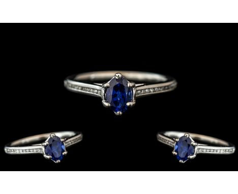 Platinum - Contemporary Sapphire and Diamond Set Dress Ring. The Faceted Cornflower Blue Sapphire of Excellent Colour, With 2