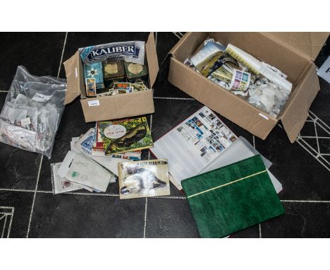 Two Boxes Containing a Quantity of Loose Commonwealth Stamps. Together with 2 albums partially filled and a collection of cig