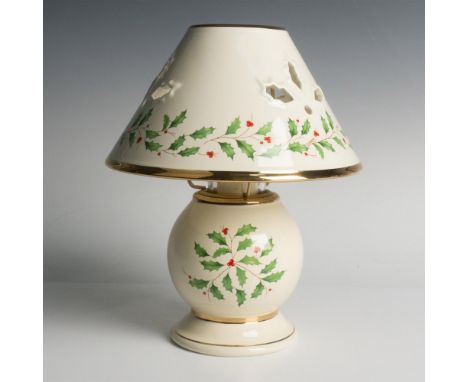 Beautiful table lamp decorated with holiday leaves and gold rims. Includes the original box, dimensions: 9.25''L x 9.25''W x 