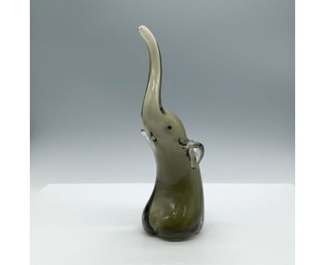 A smoky gray shiny sculpture of a seated elephant with its trunk raised upwards, featuring black eyes. Dimensions: 3"L x 4.25