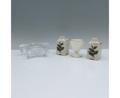 This set includes off-white salt and pepper shakers with gold-colored trims adorned with mistletoe, an egg cup also in off-wh