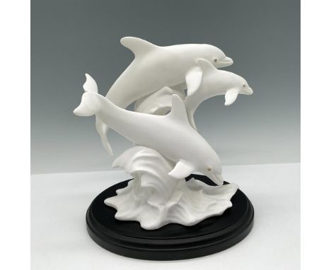 Handcrafted piece is part of the Sea Animal Collection. Design of dolphins swimming over a wave. Lenox backstamp. This item h