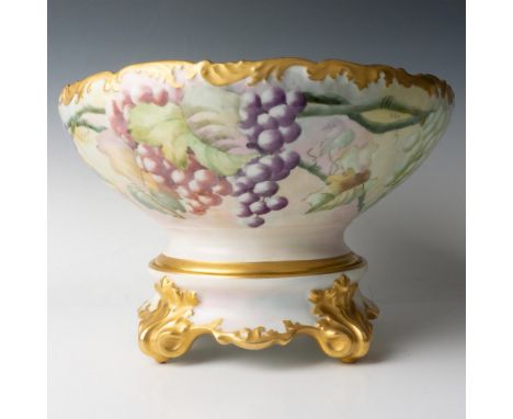 Lovely hand painted bowl decorated with grapes and vines colored in soft colors with gilt rims. T&amp;V France backstamp. Thi