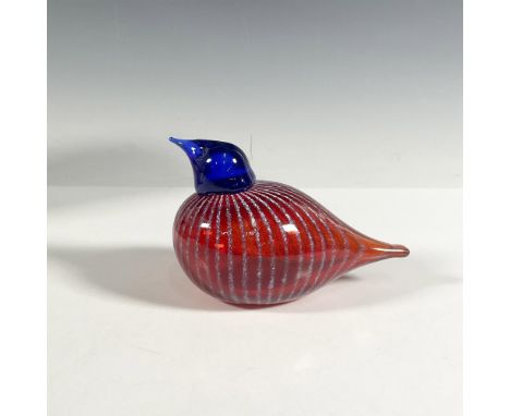 A handcrafted glass bird featuring a round body in vibrant red with delicate white stripes, topped by a striking blue head. A
