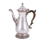 A GEORGE III SILVER BALUSTER COFFEE POT