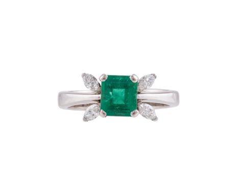 AN EMERALD AND DIAMOND RING  BIRMINGHAM 2000 The step cut emerald with canted corners, with four marquise cut diamond accents