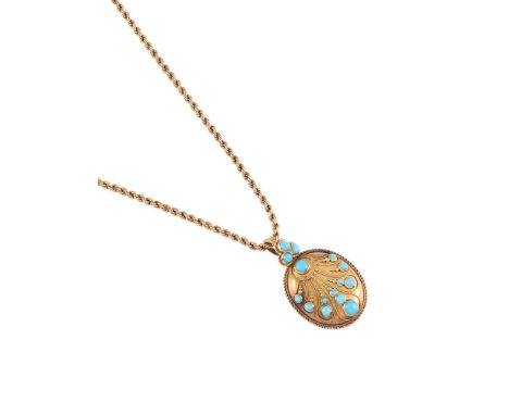 AN EARLY VICTORIAN TURQUOISE SET OVAL LOCKET  CIRCA 1860 The oval locket with a peacock feather style fan of circular cut tur