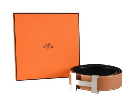 HERMÈS  A REVERSIBLE BROAD BLACK AND TAN LEATHER BELT WITH H BELT BUCKLE, CIRCA 2014 The reversible belt stamped HERMÈS PARIS