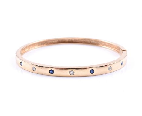A SAPPHIRE AND DIAMOND HINGED BANGLE  The polished bangle rub over set with circular cut sapphires and brilliant cut diamonds
