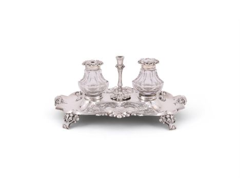 A VICTORIAN SILVER SHAPED OBLONG INKSTAND THOMAS BRADBURY & SON, SHEFFIELD 1852 With chased scroll decoration at the quarters