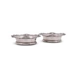 A PAIR OF VICTORIAN SILVER MOUNTED BOTTLE COASTERS