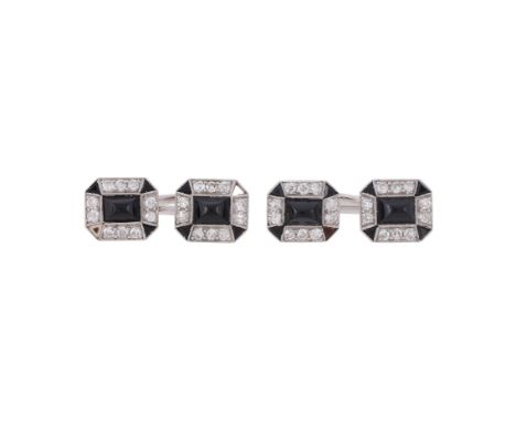 A PAIR OF ART DECO DIAMOND AND ONYX CUFFLINKS  CIRCA 1930 The octagonal panels with rectangular cabochon onyx centres within 