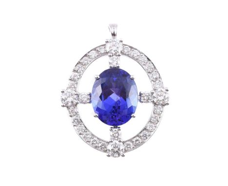 A DIAMOND AND TANZANITE PENDANT The central oval cut tanzanite estimated to weigh 8.20 carats, within a cross and hoop settin