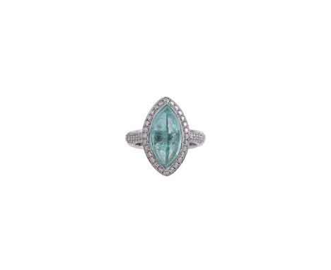 A GREENISH BLUE TOURMALINE AND DIAMOND CLUSTER RING The cabochon marquise shaped tourmaline stated to weigh 5.40 carats, with