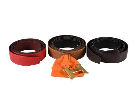 HERMÈS  THREE REVERSIBLE LEATHER BELTS WITH A H BELT BUCKLE  The first a red and burgundy reversible leather belt stamped HER