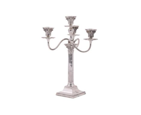 A VICTORIAN SILVER FOUR LIGHT CANDELABRUM MARTIN, HALL & CO., LONDON 1886 With four beaded sconces, chased acanthus leaf capi