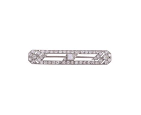 A PIERCED GEOMETRIC DIAMOND PANEL BROOCH The pierced brooch set with a central step cut diamond, with a surround of eight cut