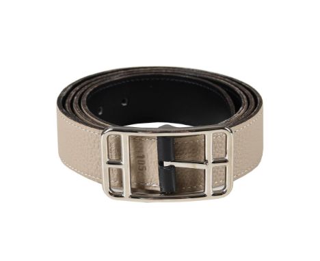 HERMÈS  A REVERSIBLE BLACK AND BEIGE LEATHER BELT WITH CAPE COD BUCKLE, CIRCA 2007  The reversible belt stamped HERMÈS PARIS 