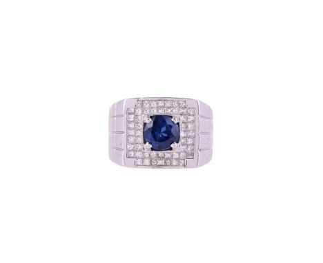 A SAPPHIRE AND DIAMOND CLUSTER DRESS RING  LONDON 2004 The panel set with princess cut diamonds in invisible settings, approx