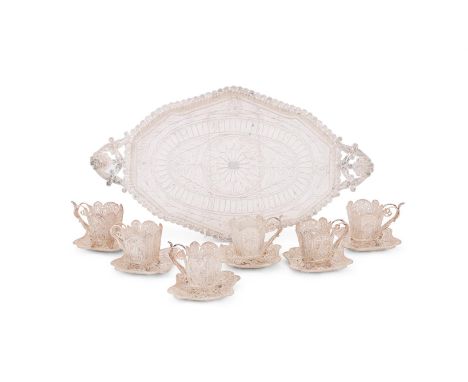 A CASED SILVER COLOURED FILIGREE COFFEE SET UNMARKED Comprising a twin handled tray, six coffee cups and saucers The tray 40.