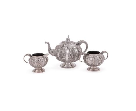 AN INDIAN SILVER SWAMI THREE PIECE LOBED CIRCULAR TEA SET UNMARKED, LATE 19TH CENTURY  The tea pot with an elephant finial to