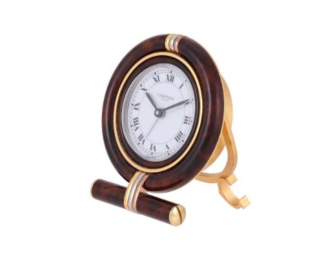 CARTIER, REF. 7522  A BRASS AND BROWN LACQUER TRAVEL ALARM DESK CLOCK, NO. 07612Movement: Swiss quartz alarm Case: Brass and 