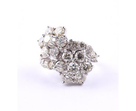 A DIAMOND DOUBLE CLUSTER RING  SHEFFIELD 2000 The double diamond clusters to crossover shoulders, approximately 4.30 carats t