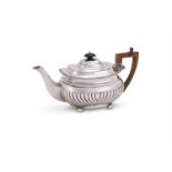 A VICTORIAN SILVER OBLONG BALUSTER TEA POT
