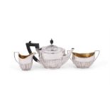 A VICTORIAN SILVER THREE PIECE OVAL TEA SET