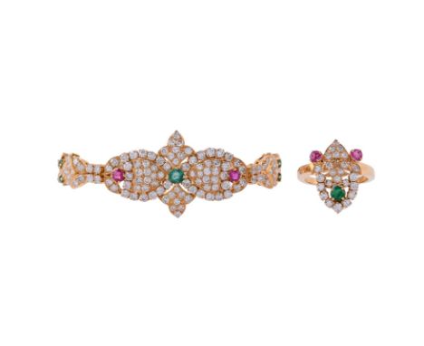 A DIAMOND, RUBY AND EMERALD DRESS RING AND BRACELET The ring with a shaped brilliant cut diamond panel with foliate detail, a