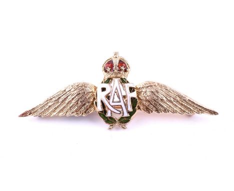 A MID 20TH CENTURY RAF BROOCH The gold coloured brooch with outstretched textured wings and white enamelled RAF insignia, upo