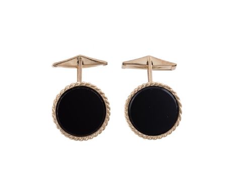 A PAIR OF 9 CARAT GOLD AND ONYX CUFFLINKS  LONDON 1983 The circular polished onyx panels within gold rope twist surrounds, to