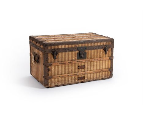 LOUIS VUITTON  A STRIPED COATED CANVAS HARD TRAVELLING TRUNK, NO. 31083, 20TH CENTURY With metal trim, wood slats, two swing 