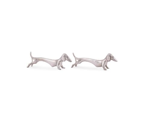 A PAIR OF SILVER COLOURED DACHSHUND KNIFE RESTS STAMPED STERLING 9cm (3 1/2in) long 122g (3.95 oz)   Condition Report:  Light