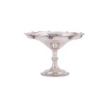 A SILVER SHAPED CIRCULAR PEDESTAL DISH