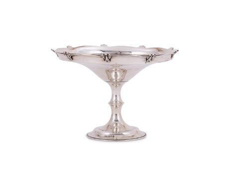A SILVER SHAPED CIRCULAR PEDESTAL DISH MAKER'S MARK F. R. ..., BIRMINGHAM 1911 With a scroll border, a waisted stem and on a 