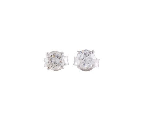 A PAIR OF SINGLE STONE DIAMOND EAR STUDS The brilliant cut diamonds in four claw settings, approximately 1.10 carats total, w