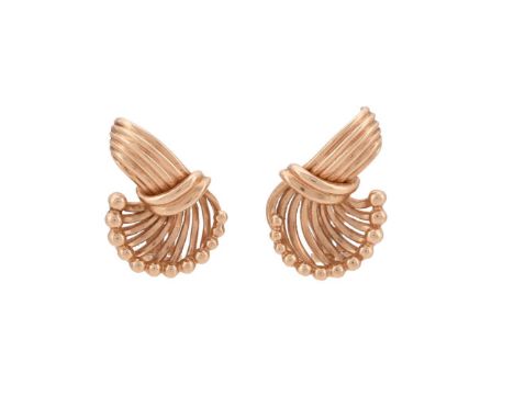 A PAIR OF GOLD COLOURED SCROLLED EAR CLIPS  The scrolled polished wire clips with graduated beaded terminals, the clips stamp