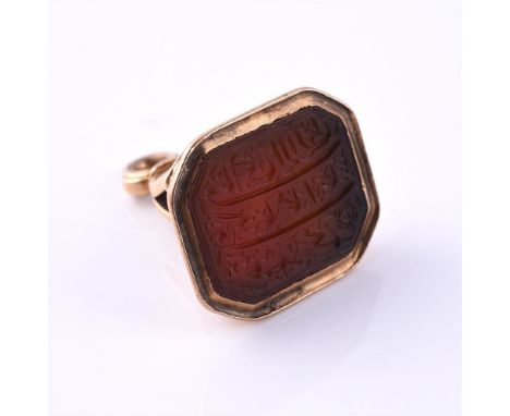 A LATE 18TH CENTURY GOLD AND CORNELIAN FOB SEAL INSCRIBED WITH ARABIC SCRIPT CIRCA 1780 The octagonal cornelian panel carved 