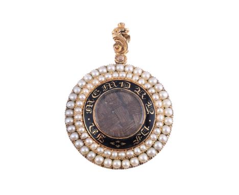 A WILLIAM IV GOLD, ENAMEL AND SEED PEARL MOURNING LOCKET  CIRCA 1833 The circular panel with a central glazed locket containi