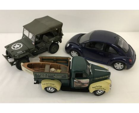 A diecast 1947 Studebaker " Thoms Bait & Tackle " with fishing boat to rear. Together with a VW Beetle and USA Army Jeep. 