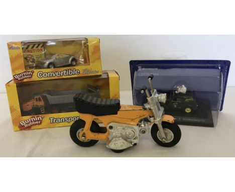 A vintage 1970's Tonka Monkey Bike with friction action. Together with a boxed Burning Rubber transporter truck , a boxed Bur