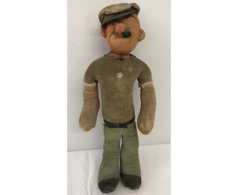 A vintage Dean's Rag Book Co. Popeye. Velvet body with wired limbs . Some fading and discolouration. Original label in tact t