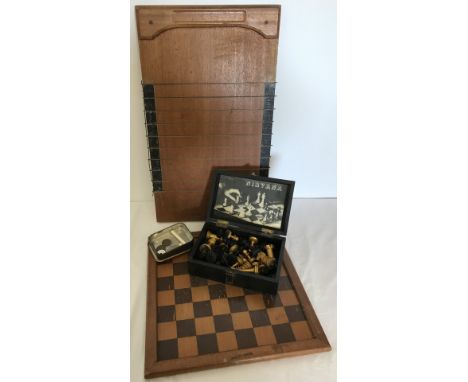 A Jacques, London shove half penny board and coins. Together with a vintage chess board with cased metal chess pieces. 