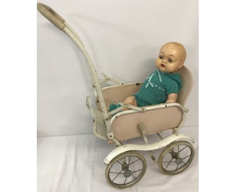 A vintage Marmet metal framed dolls pushchair together with a vintage doll.  