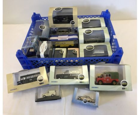 18 cased Oxford vehicles to include commercials, military and automobile company. Various scales. 