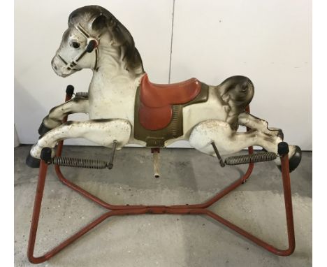 A large vintage tinplate MOBO Prairie King rocking horse.  Approx. 100cm long.